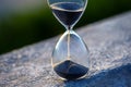 Hourglass counts the length of time against. The concept of the fluidity of life time in the universe. time and light Royalty Free Stock Photo