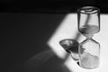 Hourglass on the desk Striking light, shadow and glass reflections Royalty Free Stock Photo
