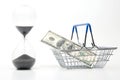 Hourglass, dollars and shopping cart for market groceries on white background