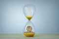 Hourglass with euro coins inside - Time is money concept Royalty Free Stock Photo