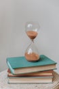 Hourglass flask retro stand stack books measuring