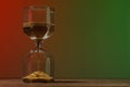 Hourglass with flowing sand on wooden table against color background, space for text Royalty Free Stock Photo