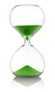 Hourglass with green sand running through