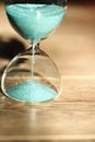 An hourglass measuring the passing time in a countdown to a deadline Royalty Free Stock Photo