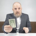 Hourglass next to the hands of a business man. business time. success goals planning Royalty Free Stock Photo