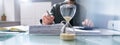 Hourglass In Office. Crunch Time Royalty Free Stock Photo
