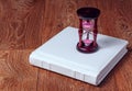 Hourglass and open book on wooden table Royalty Free Stock Photo