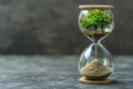 Hourglass with planet earth and tree inside on grey background, concept of time for environmental protection and climate chan Royalty Free Stock Photo