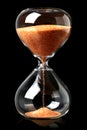 Hourglass with red sand showing the passage of time Royalty Free Stock Photo