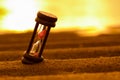 HOURGLASS ON THE SAND Royalty Free Stock Photo