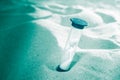 Hourglass on a sand dune beach. concept passage of time Royalty Free Stock Photo