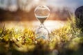 Hourglass at sunset concept for time passing Royalty Free Stock Photo