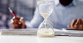Hourglass And Time Crunch With Document Royalty Free Stock Photo