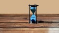 Hourglass Time Hour on a wood background with plenty of room for type. Royalty Free Stock Photo