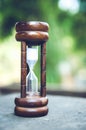 Hourglass time passing concept for business deadline, urgency and running out of time Royalty Free Stock Photo