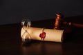 Hourglass, wooden gavel and testament and last will in notary office Royalty Free Stock Photo