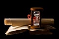 Hourglasses and book On black Royalty Free Stock Photo