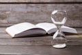 Hourglasses and book. Royalty Free Stock Photo