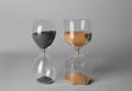 Hourglasses on grey background. Time management concept Royalty Free Stock Photo