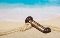 Hourglasses and rope on the sandy coast Royalty Free Stock Photo