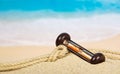 Hourglasses and rope on the sandy coast Royalty Free Stock Photo