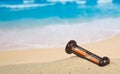Hourglasses on a sandy beach Royalty Free Stock Photo
