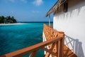 House above sea with wooden bridge and view of tropical island Royalty Free Stock Photo