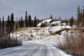 House above Snow Covered Hill