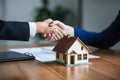 House agent and buyer shaking hands after signing contract. Business partnership. Mortgage, home loan and insurance Royalty Free Stock Photo