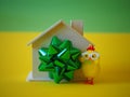 House as gift, ribbon and chicken toy Royalty Free Stock Photo