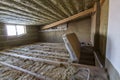 House attic under construction. Mansard walls and ceiling insulation with rock wool. Fiberglass insulation material in wooden fram Royalty Free Stock Photo