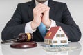 House auction concept. Lawyer with gavel and house model Royalty Free Stock Photo