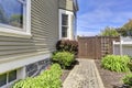 House backyard view. Walkway with bushes alongside Royalty Free Stock Photo