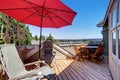 House balcony with wooden table set, folding chairs Royalty Free Stock Photo