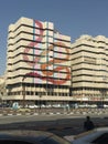 House with a beautiful tattoo. A beautiful multi-storey building with a yellow-red dragon pattern.