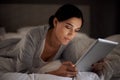 House, bedroom and woman reading with tablet on app, online with connection to internet. Night, female person and girl Royalty Free Stock Photo