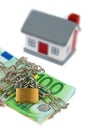 House with bills, chain and padlock Royalty Free Stock Photo