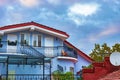 House with blue walls against the sky with clouds Royalty Free Stock Photo