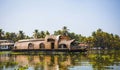 House-boat pleasure cruise ship in India  Kerala on the seaweed-covered river channels of Allapuzha in India. Boat on the lake in Royalty Free Stock Photo