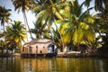 House-boat pleasure cruise ship in India  Kerala on the seaweed-covered river channels of Allapuzha in India. Boat on the lake in Royalty Free Stock Photo