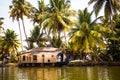 House-boat pleasure cruise ship in India  Kerala on the seaweed-covered river channels of Allapuzha in India. Boat on the lake in Royalty Free Stock Photo