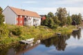 House and boat at the river.