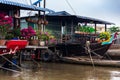 House boats with paper flowers, orchids and yellow flowers for Tet New Year Celebration, Mekong Delta, Vietnam