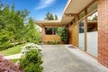 House with brick trim. Entrance porch and front yard view Royalty Free Stock Photo