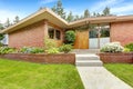 House with brick trim. Entrance porch and front yard view Royalty Free Stock Photo