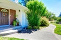 House with brick wall trim. View of entrance porch and walkway Royalty Free Stock Photo