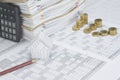 House and brown pencil have blur step pile gold coins Royalty Free Stock Photo