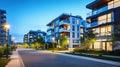 House building and city construction concept: evening outdoor urban view of modern real estate homes Royalty Free Stock Photo