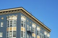 House or building facade in the downtown city neighborhoods with blue stucco and white accent exterior with flat roof Royalty Free Stock Photo