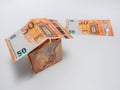 House built with fifty euro bills on a white background Royalty Free Stock Photo